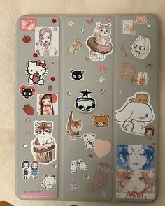 an assortment of stickers on the back of a laptop