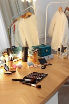 Different cosmetic products on wooden dressing table in makeup room Wooden Dressing Table