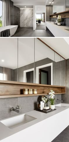 a bathroom with two sinks, mirrors and vases on the counter top in front of it