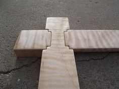 a wooden cross laying on the ground