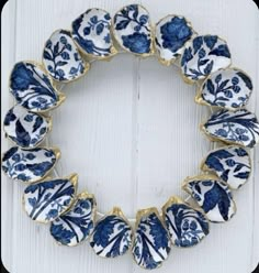 a blue and white wreath with flowers on it