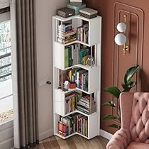 a living room with a pink chair and bookshelf