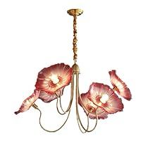 a chandelier with pink flowers hanging from it's arms and two lights on each side