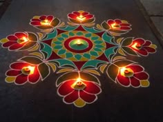 a decorated floor with lit candles on it