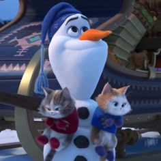 two kittens are standing next to a snowman in disney's frozen world