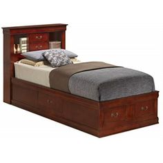 a bed with two drawers underneath it and a night stand on the bottom one side