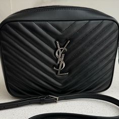 100% Authentic! Brand New Store Display Item - No Flaws Or Blemishes. Ysl Saint Laurent Medium Lou Crossbody Bag In Black Quilted Leather. Features Ysl Logo Lettering Shoulder Strap Zip Top Closure Exterior, Back Slip Pocket Aged Silver Hardware. Interior, One Slip Pocket Approx. 6.3"H X 9.8"W X 2.5"D Made In Italy Ysl Camera Bag, Ysl Crossbody Bag, Ysl Saint Laurent, Ysl Logo, Vanity Bag, Croc Leather, Saint Laurent Wallet, Leather Mary Janes, Black Crossbody