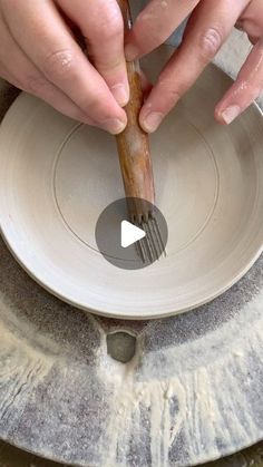 the person is making something out of clay