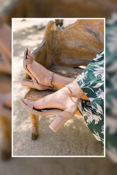 woman wearing a light brown neutral pashionista style with a brown and white floral dress. Perfect vacation shoes. Convert to flats. passion footwear. Red Heels