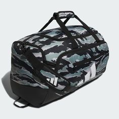 the adidas duffel bag in camo print is shown with black and white stripes