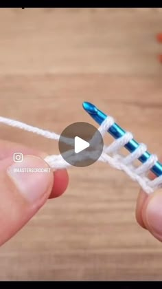 someone is holding a crocheted toothbrush holder in their left hand, with the video below it