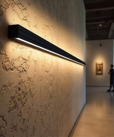 The 3.75-inch linear wall light comes with an extruded aluminum housing finished in a durable powder coat. Designed for continuous runs of up to 40 feet at 120V and 100 feet at 277V, the wall light features a regressed lens to reduce glare, delivering 450 to 900 lumens in full downlight mode and 500 to 1,000 lumens in a 50/50% uplight and downlight setting. The fixture includes a 7-position DIP switch for directional lighting, CCT adjustable settings (3000K, 3500K, 4000K), 0-10V dimming and optional emergency backup. Damp location rated for outdoor use under cover. Wall Washer Lights, Lighting Plan Interior, Indirect Lighting Ceiling, Hanging Bar Lights, Recessed Linear Lighting, Wall Washer Lighting, Led Linear Lighting, Linear Wall Light, Frame Lighting