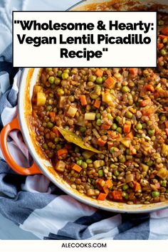 a large pot filled with lentils and carrots on top of a checkered table cloth