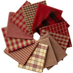 a bunch of different colored plaid cloths