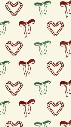 a pattern with hearts and bows on a white background that is very similar to candy canes