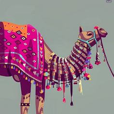 a colorfully decorated camel with tassels on it's back and neck