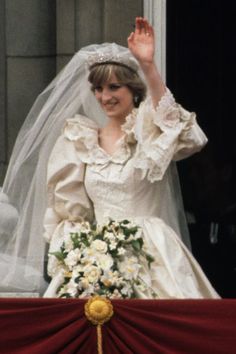 the princess waves from her balcony on her wedding day