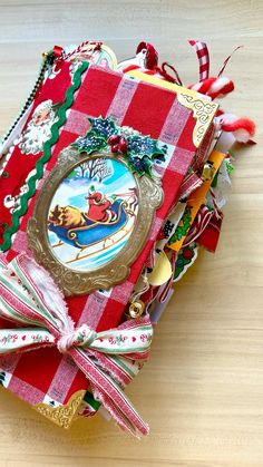 a red and white checkered christmas card box with santa's sleigh on it