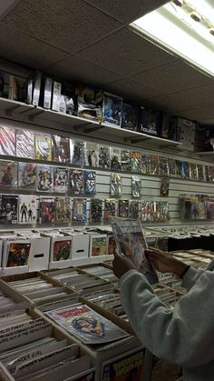 a man looking at comics in a store