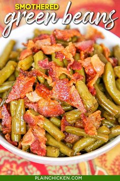 green beans with bacon in a white bowl on a red and yellow tablecloth that says smothered