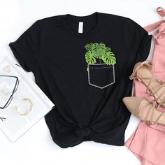 🌱 It's the 21st century, join plant mom and dad's everywhere and support plant parenthood! CHOOSING A SIZE: * Please see the size charts in the listing images. Measure twice, ship once! * Women's tees are fitted. For a looser fit, order a size up. * Our unisex tees look great on men and women! * Questions? Contact us! APPAREL QUALITY: * All of our apparel is pre-shrunk. * Our prints are made to last for years via direct-to-garment (DTG) printing technology. SHIPPING TIMES: * 2-4 business days t Casual Black T-shirt With Plant Print, Spring Green Tops With Plant Details, Cotton T-shirt With Plant Detail, Short Sleeve, Green Cotton T-shirt With Plant Print, Green Relaxed Fit T-shirt With Plant Detail, Casual Relaxed Fit T-shirt With Plants, Crew Neck Cotton T-shirt With Plant Details, Cotton Crew Neck T-shirt With Plant Details, Cotton Crew Neck T-shirt With Plants