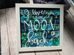 an art print with the words i love you to the moon and back on it