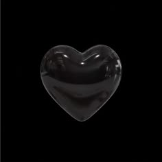 a black heart shaped object in the dark