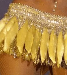 a close up of bananas on a woman's leg with sequins and beads