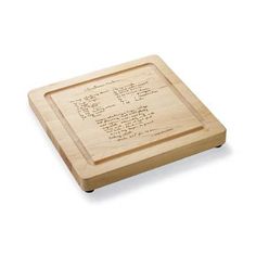 a wooden cutting board with writing on the front and back sides, in black ink