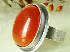 Unique handmade jewelry made by me Stone: Orange Carnelian The dimension of stone: 21x17 mm material: Sterling silver (Ag 925) Please, be sure of your ring size before ordering. We don't refund if it's the wrong size. You will get exactly what you see in the pictures, just keep in mind that colors may slightly vary due to different monitor calibrations. Jewelry (including resized rings) are not refundable. We ship from three to seven (3 -7) working days after receiving your payment. Allow 7-14 d Fluorite Ring, Orange Carnelian, Jasper Ring, Moss Agate Ring, Carnelian Ring, Amber Ring, Agate Ring, Unique Handmade Jewelry, Onyx Ring