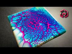 a blue and pink painting on top of a table