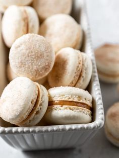 several different types of pastries in a white container