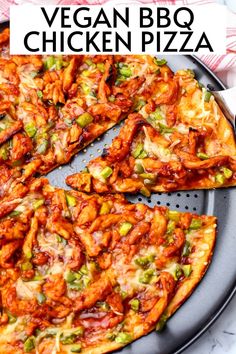 the vegan bbq chicken pizza is cut into four pieces and sits on a plate