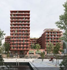 an artist's rendering of two red buildings next to each other on the water