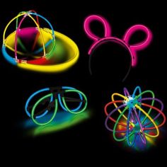 four different colored glasses with mickey ears and neon lights in the shape of an object