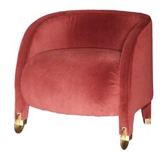 a red velvet chair with gold legs and an oval shaped armrest, on a white background