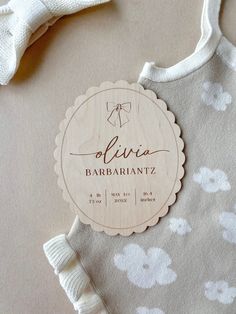 a baby bib with a name tag on it