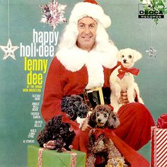 a magazine cover with a man in santa claus's outfit holding several poodles