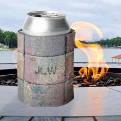 a can is sitting on top of a fire pit