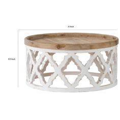 a white coffee table with an intricate design on the top and bottom, measurements for each side