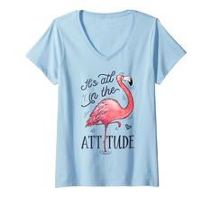 a women's blue shirt with an image of a pink flamingo on it