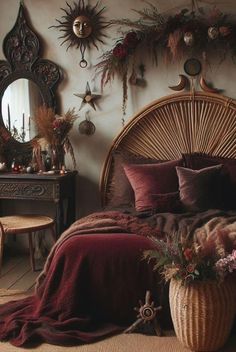 a wicker bed with pillows and blankets on it in a room filled with decorations