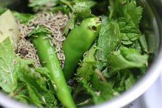 some green vegetables are in a white bowl