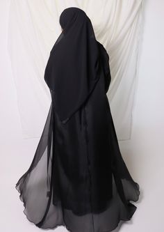 LEYLAH abaya set comes with ⁃ Long-sleeved chiffon maxi dress ⁃ Abaya in organza with seamed bodice ⁃ Chiffong hijab that is 70x170cm Color: Black Elegant Evening Chiffon Abaya, Elegant Black Abaya With Modesty Panel, Elegant Silk Floor-length Abaya, Black Formal Gown For Eid, Elegant Georgette Maxi Abaya, Elegant Silk Maxi Abaya, Long Chiffon Abaya For Parties, Floor-length Chiffon Abaya For Wedding, Elegant Floor-length Chiffon Abaya