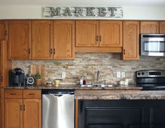 a kitchen with wooden cabinets and stainless steel appliances