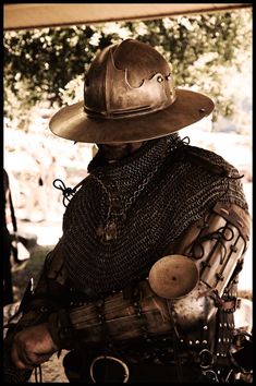 a man wearing a helmet and chain mail