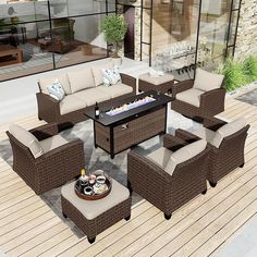 an outdoor living room with wicker furniture