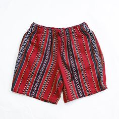 Yo, check these out - Men's Comfy Tribal Shorts in this eye-catching red! They've got a cool tribal pattern that's all about that laid-back summer style. Made with durable tribal woven fabric, they're ready for our long days at the park or just chilling at home. An 8" inseam means they're breezy enough for the heat, and the elastic waistband and drawstring keep things just where you want them. And pockets? Got 'em, so you can keep your phone and keys handy. Whether you're lounging or out at a fe Red Bottoms With Elastic Waistband For Festivals, Red Elastic Waistband Bottoms For Festival, Traditional Red Bottoms For Summer, Red Cotton Bottoms For Festival, Red Bohemian Cotton Shorts, Red Short-length Bottoms For Festival, Red Short Length Bottoms For Festival, Cotton Red Shorts For Festival, Red Cotton Shorts For Festivals