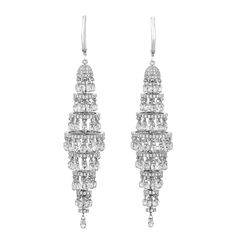 Exuding timeless luxury, this radiant pair of chandelier earrings features an impressive array of round brilliant and briolette cut diamonds totaling 19.83 carats. The dazzling stones artfully cascade in a lustrous 18K white gold setting. Sophisticated and elegant, these breathtaking chandelier earrings epitomize glamour. 3" length Luxury Diamond Jewelry, Diamond Chandelier Earrings, Diamond Chandelier, Jewelry For Sale, Timeless Luxury, Expensive Jewelry, Large Jewelry, High Jewelry, White Metal