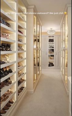 a walk in closet filled with lots of shoes